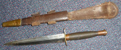 Lot 254 - A Third Pattern Commando Knife, with machine forged steel blade, ribbed anodised metal grip,...