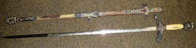 Lot 284 - An American Masonic Ceremonial Sword, the 77cm double edge steel blade etched with masonic...