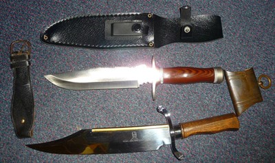 Lot 286 - A Modern Bowie Knife, with wood grip; another knife with saw back blade and leather sheath; a brass