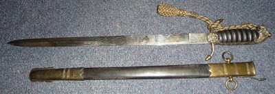 Lot 306 - An Indian Copy of a Midshipman's Dirk, with etched steel blade, the brass hilt with leather...