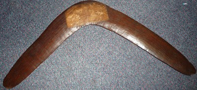 Lot 320 - A 19th Century Australian Aborigine Return Boomerang, one side set with a paper label...