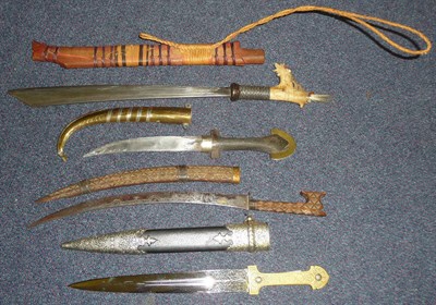 Lot 322 - A Dyak, Borneo Mandau (Head Hunter's Sword), with single edge steel blade, plaited steel wire bound