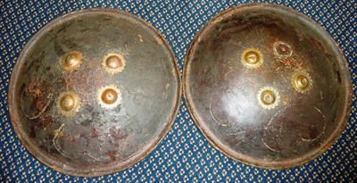 Lot 333 - An Indian Hide Dhal, of convex circular form, with upturned lip, four brass rosettes securing...