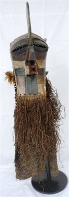 Lot 335 - A Songye Kifwebe Mask, of male form, with high crest, triangular nose and projecting square section