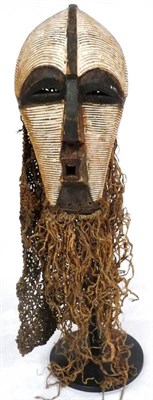 Lot 336 - A Songye Kifwebe Mask, of female form, with slightly raised medial ridge running down the domed...