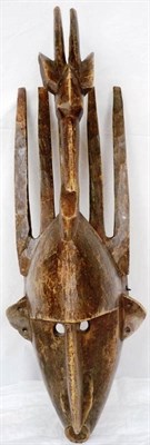 Lot 344 - A Bamana N'Tomo Mask, with five upright horns, the domed forehead surmounted by the carved...