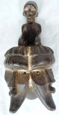 Lot 347 - A Bassa Double Face Mask, with kneeling figure headdress, over the two moon shape faces, each...