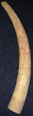 Lot 349 - A Benin, Nigeria Elephant Tusk, carved with an Oba, attendants and warriors, 63cm