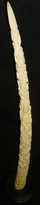 Lot 350 - A Loango, West Africa Elephant Tusk, carved in high relief with a spiral of figures climbing...