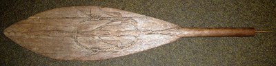 Lot 364 - A Papua New Guinea Wood Paddle, each side of the the leaf shape blade carved with a stylised...