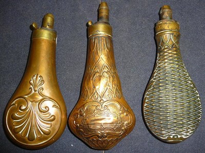 Lot 395 - Three Copper Powder Flasks, with embossed decoration of a shell and anthemion, `pineapple'...