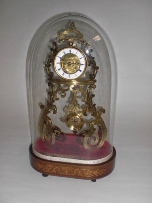 Lot 1280 - A French Brass Striking Mantel Clock, circa 1890, the elaborate  engraved and scrolled brass...