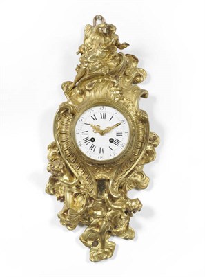 Lot 1286 - A French Ormolu Striking Cartel Clock, circa 1890, the elaborate case with scroll work and...