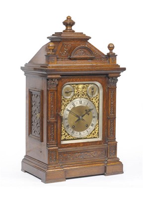 Lot 1296 - An Oak Chiming Table Clock, retailed by Lister Horsfall, Halifax, circa 1890, the caddied top...