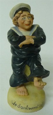 Lot 130 - A Comic Bisque Porcelain Figure of a First World War Sailor, wearing HMS Dreadnought cap, with arms