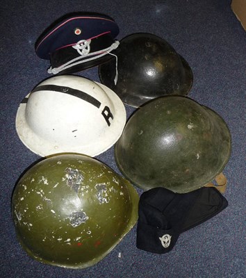 Lot 172 - Two Second World War Brodie Type Home Front Helmets, one painted black with W in white, the...
