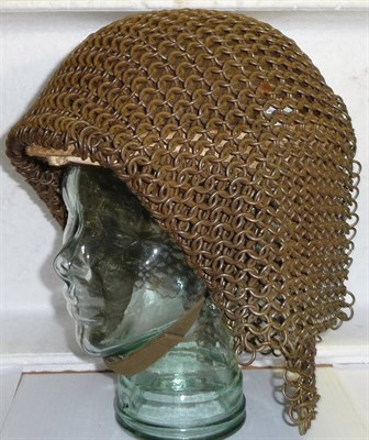 Lot 181 - A Tank Driver's Steel Helmet, lined in padded calico with webbing chin strap and heavy steel...