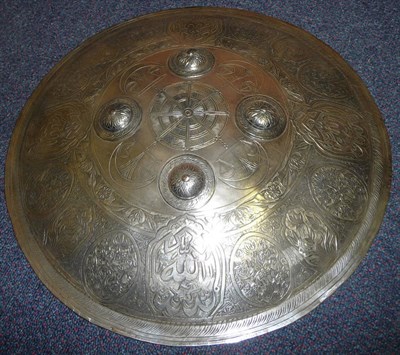 Lot 183 - A Late 19th Century Indian Steel Dhal, chased and engraved with a border of panels of script...