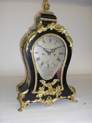 Lot 1303 - An Ebonised and Gilt Metal Mounted Striking Table Clock, the case with applied gilt metal...