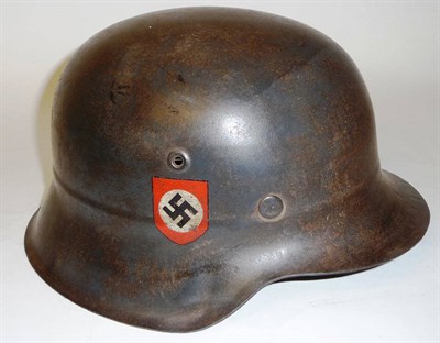 Lot 202 - A German Third Reich M42 Luftschutz Police Helmet, double decal, the inner brim stamped ET66...