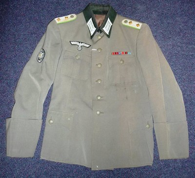 Lot 208 - A German Third Reich M36 Army Tunic, with dark green collar, BeVo quality mountain troop arm badge