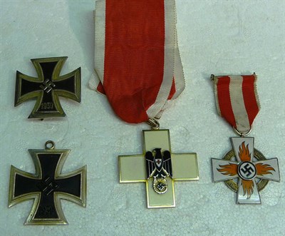 Lot 221 - A German Third Reich Fire Brigade Medal, second class, with ribbon and pin; three Copy Medals...