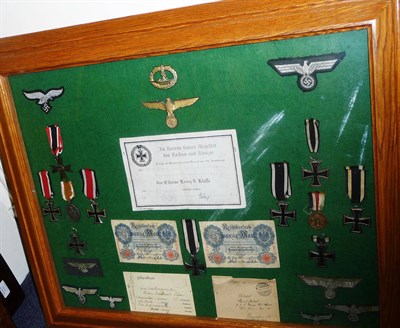 Lot 230 - A Display of German Third Reich Militaria, comprising German Defence Medal, War Merit Cross,...