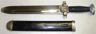 Lot 238 - A German Third Reich DRK Hewer, the saw-back fullered steel blade with squared-off tip, (the unseen