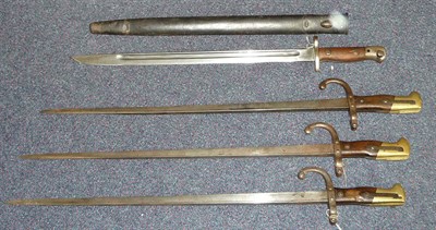 Lot 305 - Four Bayonets:- three French Model 1874 "Gras" Epee Bayonets, lack scabbards and a British...