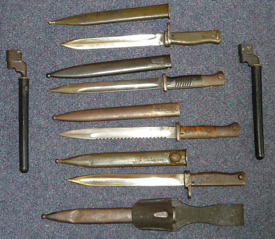 Lot 315 - Six Bayonets:- a German Model 1914 Saw Back Bayonet, the blade stamped Gottlieb Hammestahr Solingen