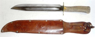 Lot 322 - A Bowie Knife, with 25.5cm hatchet tip steel blade, brass oval crossguard, antler grip and...