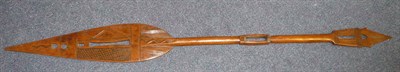 Lot 326 - A West African Wood Dance Paddle, with pierced and diaper carved leaf shape blade, the...