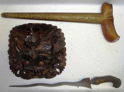 Lot 332 - A Malayan Kris, with wavy damascened blade, carved wood grip and two piece wood scabbard with...