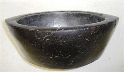 Lot 346 - An Egyptian Bowl, of elliptical form, carved from an aubergine coloured stone boulder, 28cm