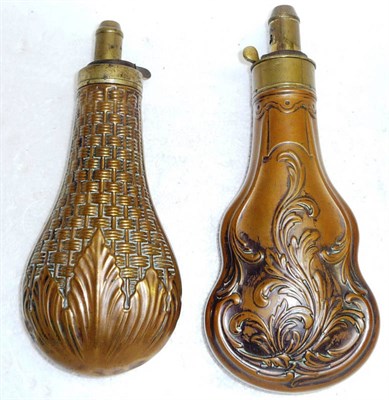 Lot 375 - Two Copper Powder Flasks, one of foliate embossed violin shape, the other of pear shape...