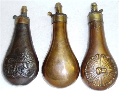 Lot 377 - Three Copper Powder Flasks, of pear shape, one plain, one embossed with a dog's head within a...