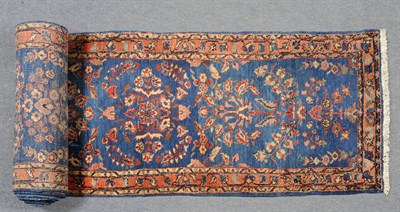 Lot 1338 - Narrow Meharan Runner West Persia The mid indigo field with sprays of flowers enclosed by...