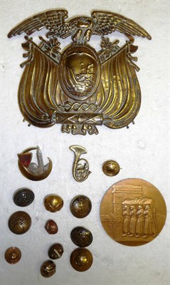 Lot 110 - A Bolivian Brass Pickelhaube Plate, with original flat clips, a small quantity of French buttons, a