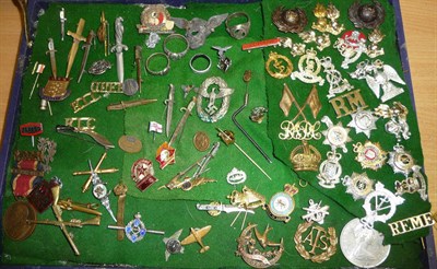 Lot 127 - A Quantity of Militaria, including cap badges, sweetheart brooches, two German Totenkopf type...