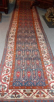 Lot 1343 - Malayir Runner West Persia The indigo field of botehs enclosed by ivory borders of meandering vines