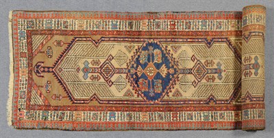 Lot 1344 - Sarab Runner Persian Azerbaijan The camel field with twin lozenge panels centred by indigo...