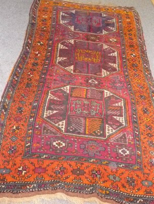 Lot 1345 - Yuruk Rug Eastern Anatolian The claret field with three quartered octagons enclosed by wide...