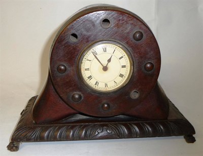 Lot 158 - A Teak Mantel Timepiece, made from the hub of a laminated propeller blade, the circular cream...