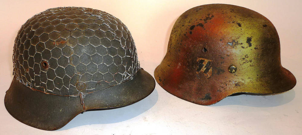 Lot 173 - Two Replica German Helmets, one with camouflage paint and leather liner, the other with Heer...