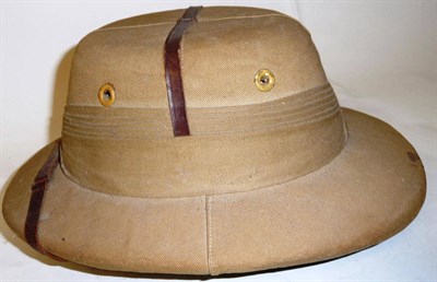 Lot 186 - A Colonial Khaki Pith Helmet, with pleated puggaree, leather strap and cloth sweatband, with...