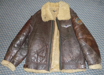 Lot 198 - An American Air Force Sheepskin Flying Jacket, with zip fastening and embroidered breast badge