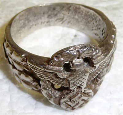 Lot 214 - A Copy of a German Third Reich SS Police Ring, pierced and worked with an eagle and swastika...