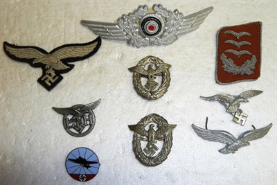 Lot 216 - A German Third Reich Luftwaffe Badge, in blue, black and red enamel, the reversed embossed...