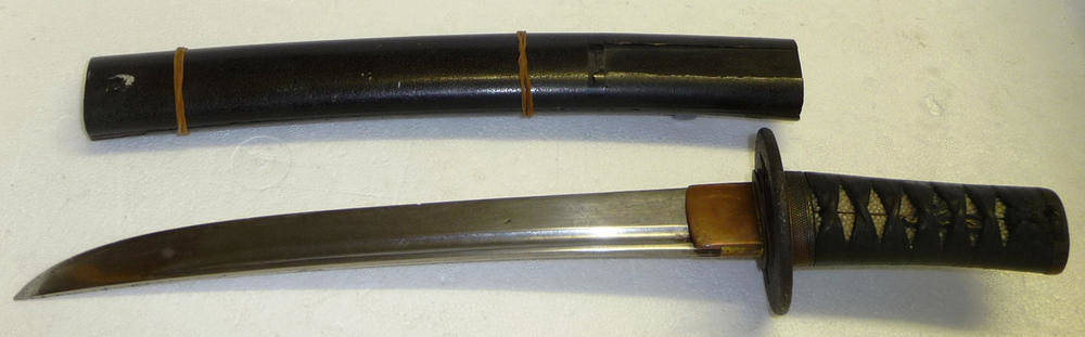 Lot 224 - A 16th Century Japanese Tanto Dagger, the 26cm steel blade with a narrow fuller to the top...