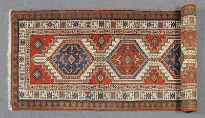 Lot 1353 - Narrow Sarab Runner Persian Azerbaijan The ivory field with five stepped medallions enclosed by...